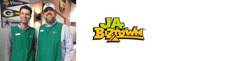A photograph of two smiling men in green vests, alongside a logo for JA BizTown